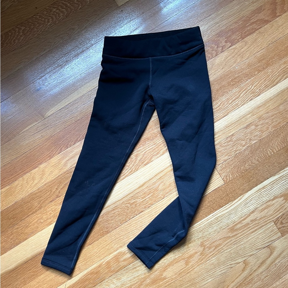 Like New Athleta Girls Fleece lined leggings.    Size Medium